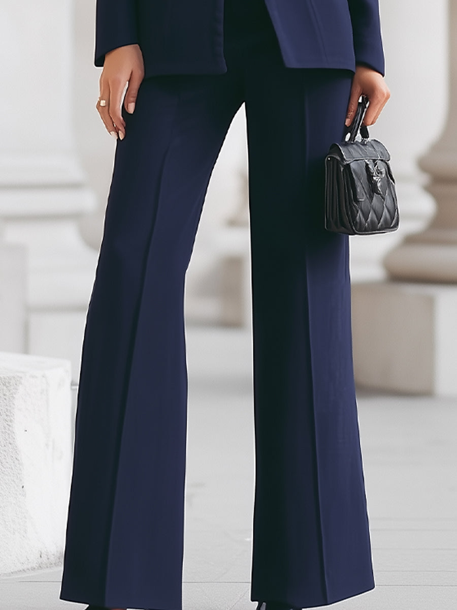 Contemporary women's formalwear, a sharp blazer and trouser suit designed for elegant events
