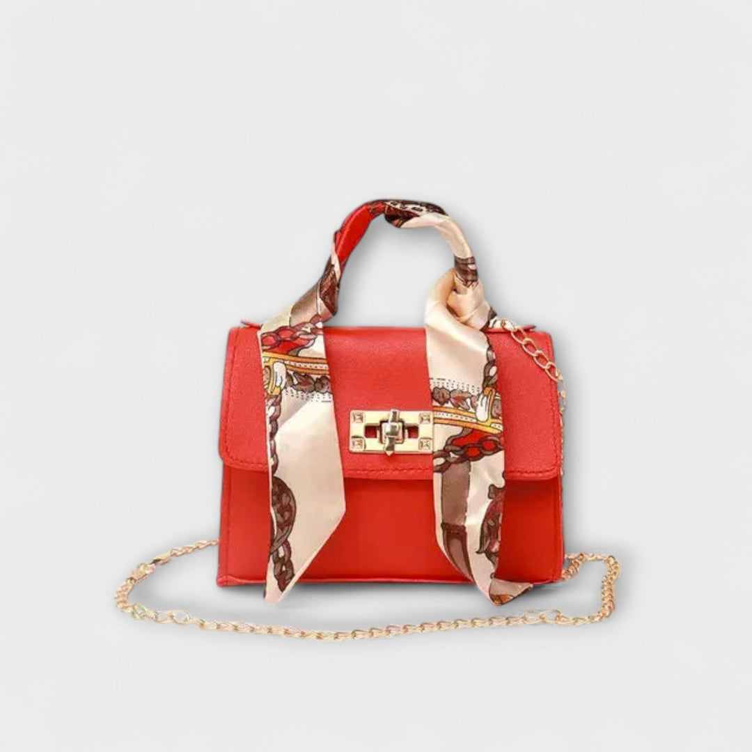 Sleek women's silver chain shoulder bag, elegant accessory suitable for evening or day wear.