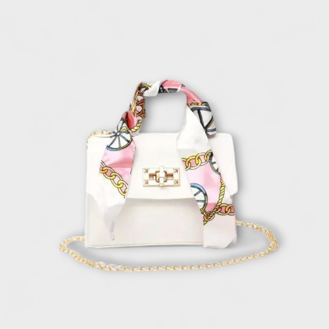 Vibrant women's yellow chain crossbody bag, a playful yet elegant summer fashion accessory.