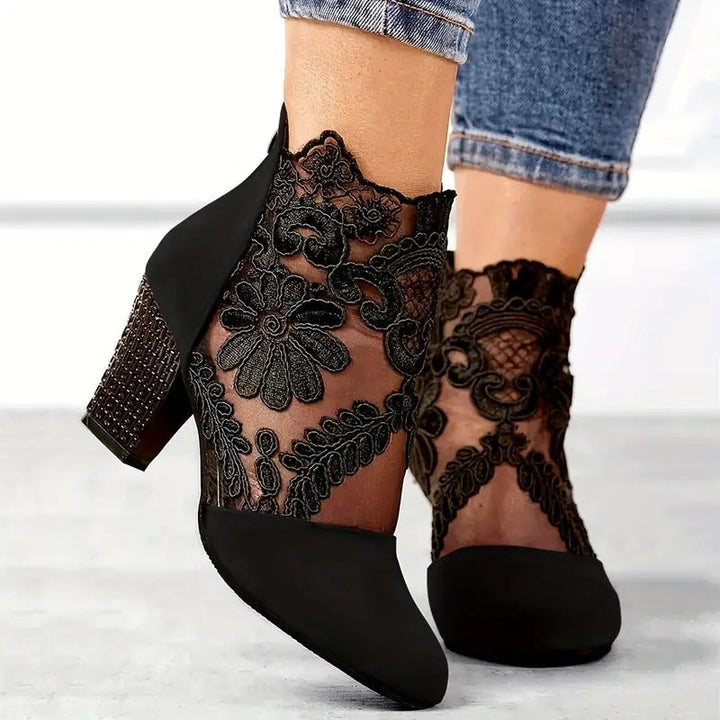 Floral lace heeled elegant shoes for women, ideal party footwear with intricate design.