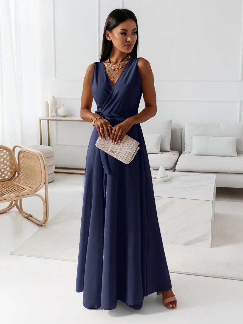 Full-length view of a women's flowing green wrap maxi dress, a perfect choice for an elegant summer event