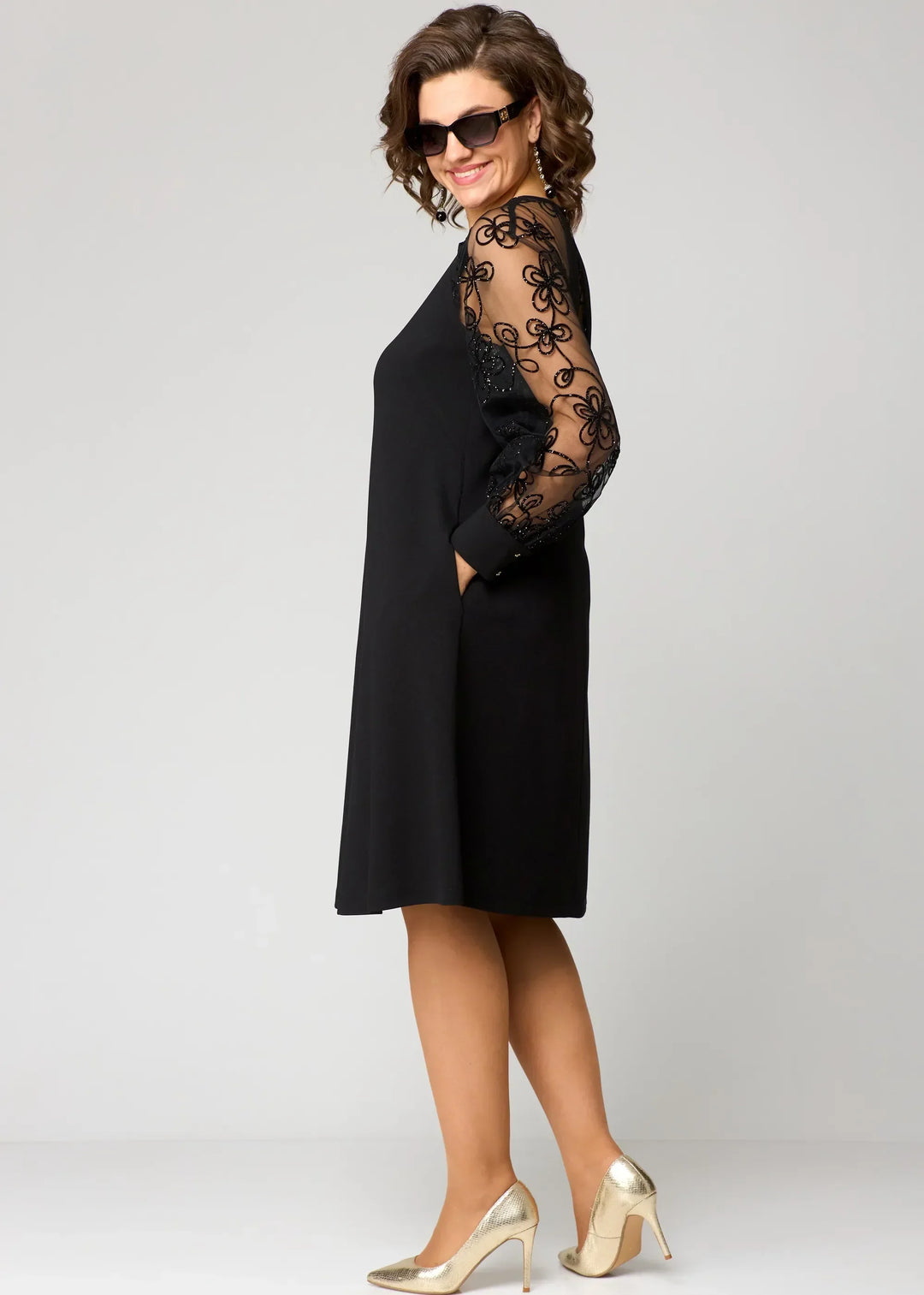 Detailed shot of delicate lace fabric on a women's elegant A-line party dress