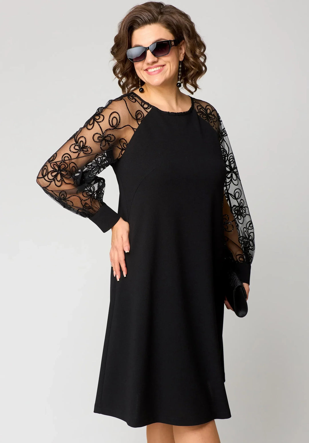 Close-up of the elegant A-line silhouette and delicate lace on a women's dress