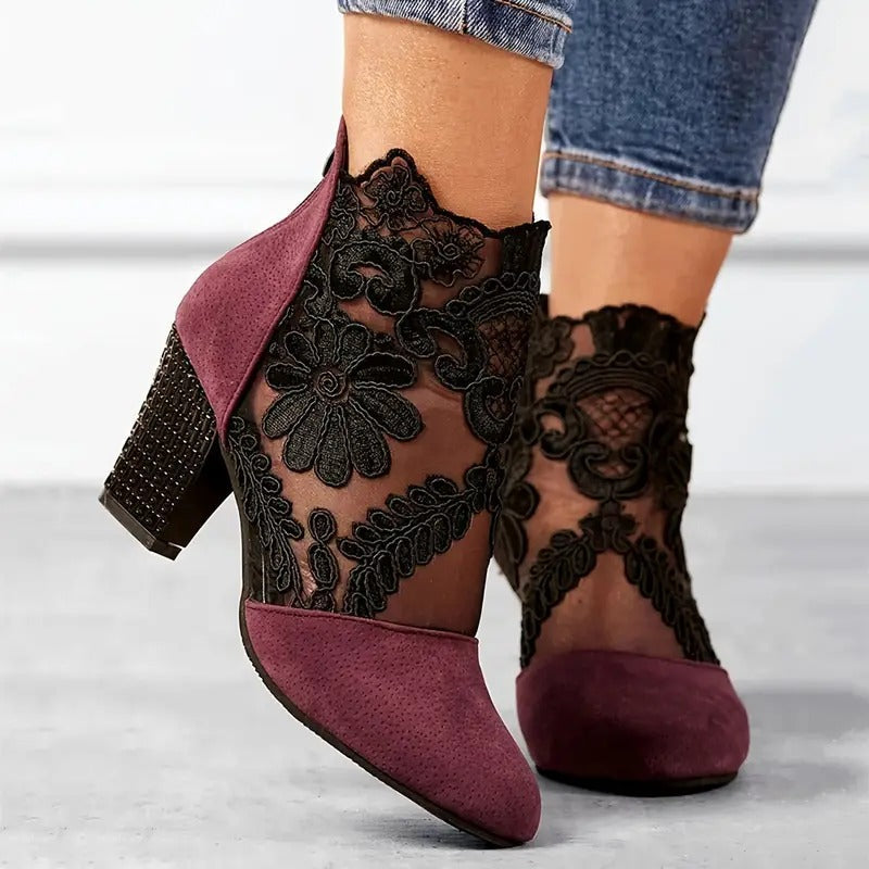Elegant women's white lace heels with intricate floral design, perfect for weddings or special occasions, providing comfort and style.