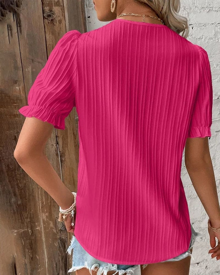 Sophisticated women's white V-neck blouse with delicate lace, perfect for summer.