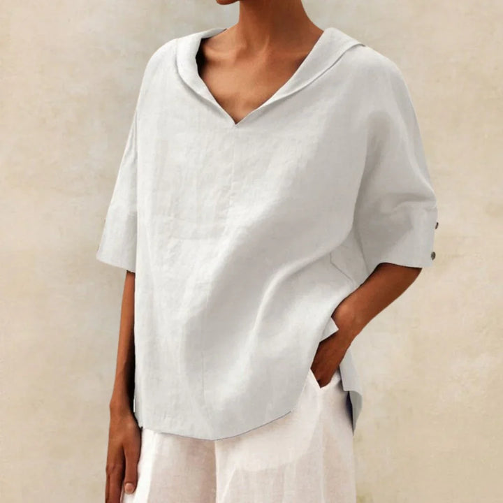 Elegant women's white linen button-down shirt, long sleeve, for summer resort wear