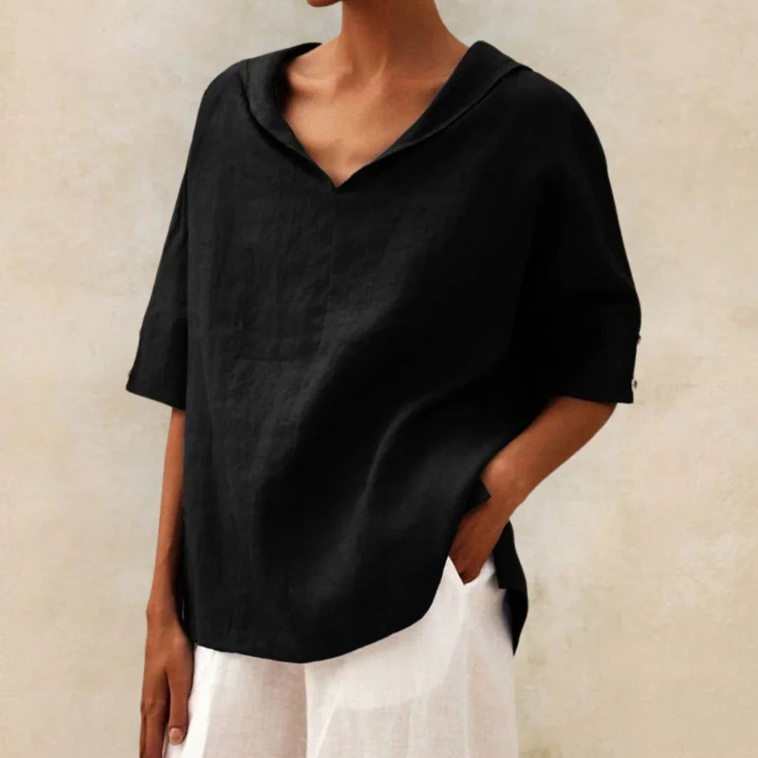 Close-up of breathable linen fabric on a white women's casual button-down shirt