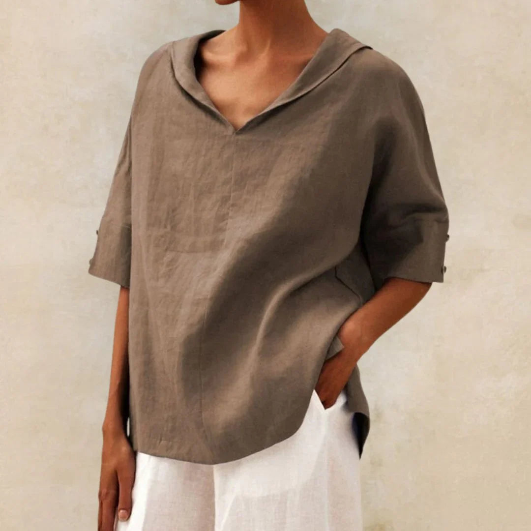 Versatile white linen shirt with buttons, ideal as a women's summer top or beach cover-up