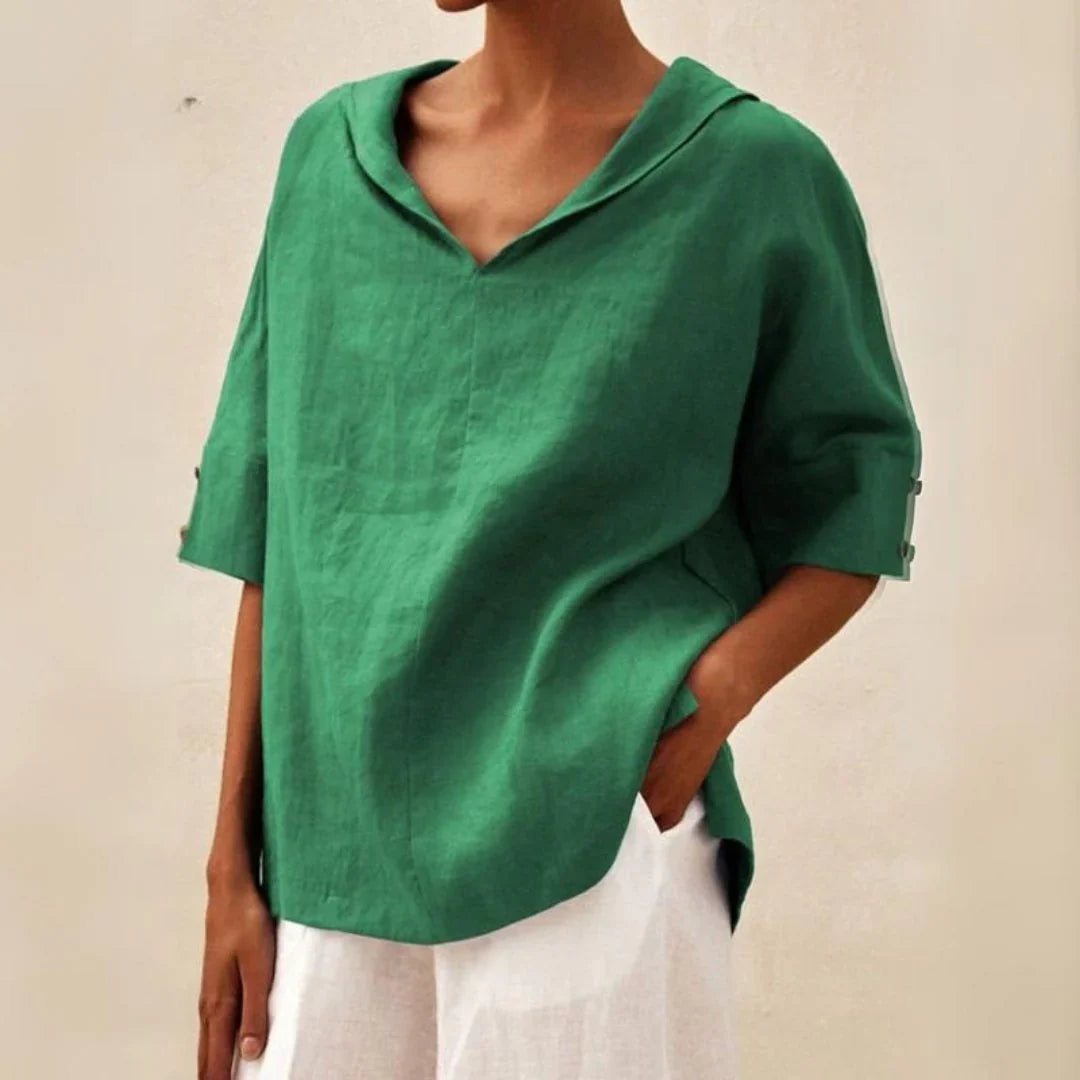 Stylish women's linen shirt in white, featuring a classic button-down design and relaxed fit