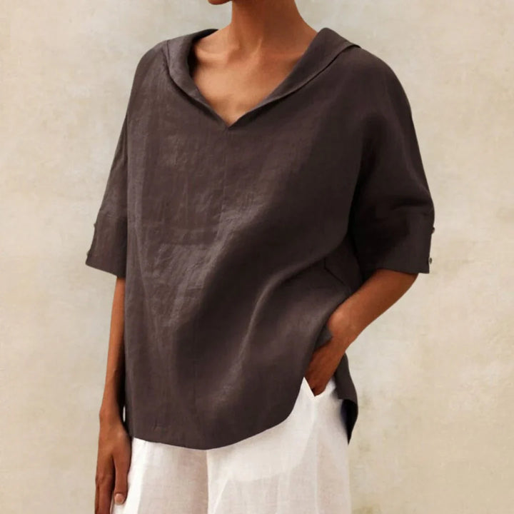 Detail of the buttons and collar on a new elegant white women's linen summer shirt