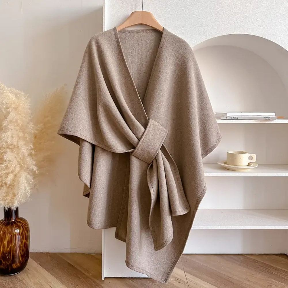 Close-up of the textured microfiber blend fabric of a women's elegant wind-resistant shawl coat.