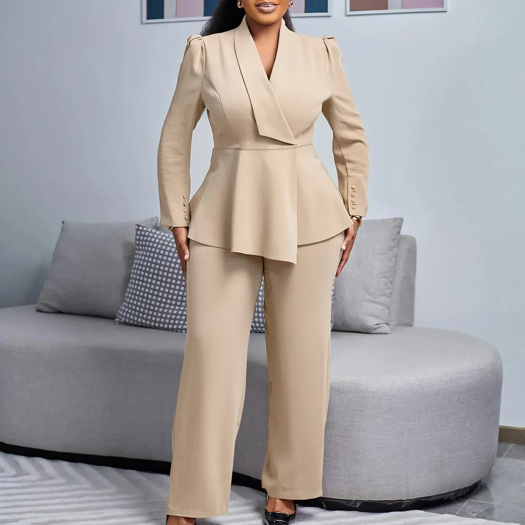 Elegant women's white suit set with a tailored long blazer and matching trousers, perfect for professional officewear.
