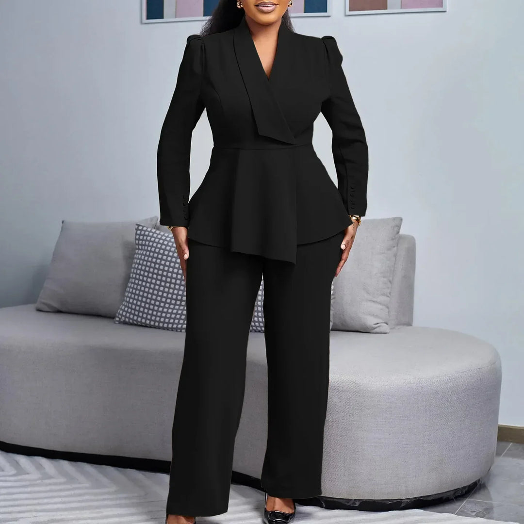 Modern women's formalwear suit set; a sleek long blazer paired with smart trousers, designed for elegance and officewear.