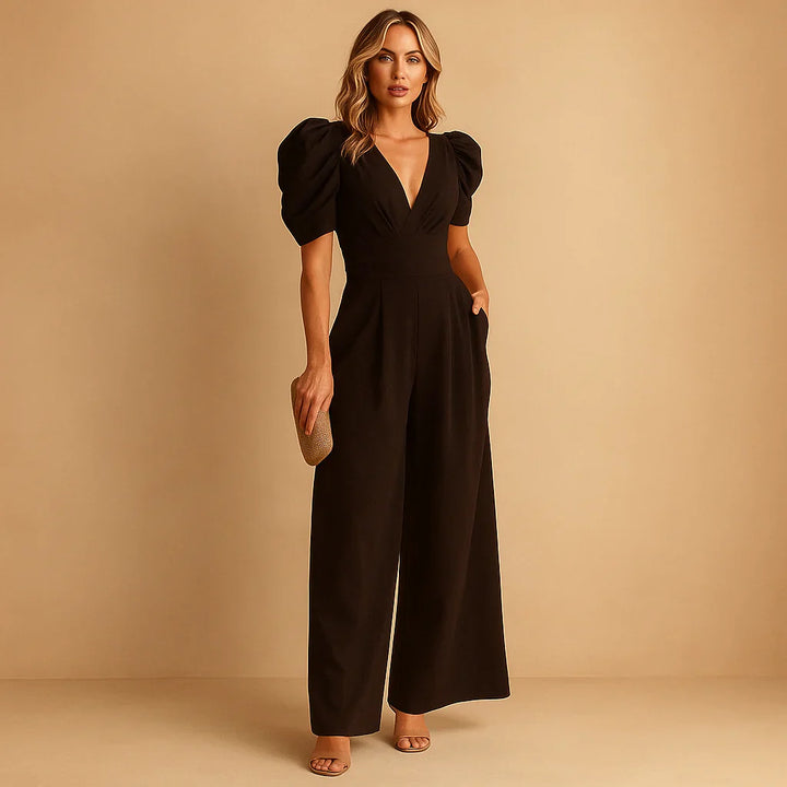 Women's formal black long sleeve jumpsuit featuring elegant puff shoulders and tailored fit.