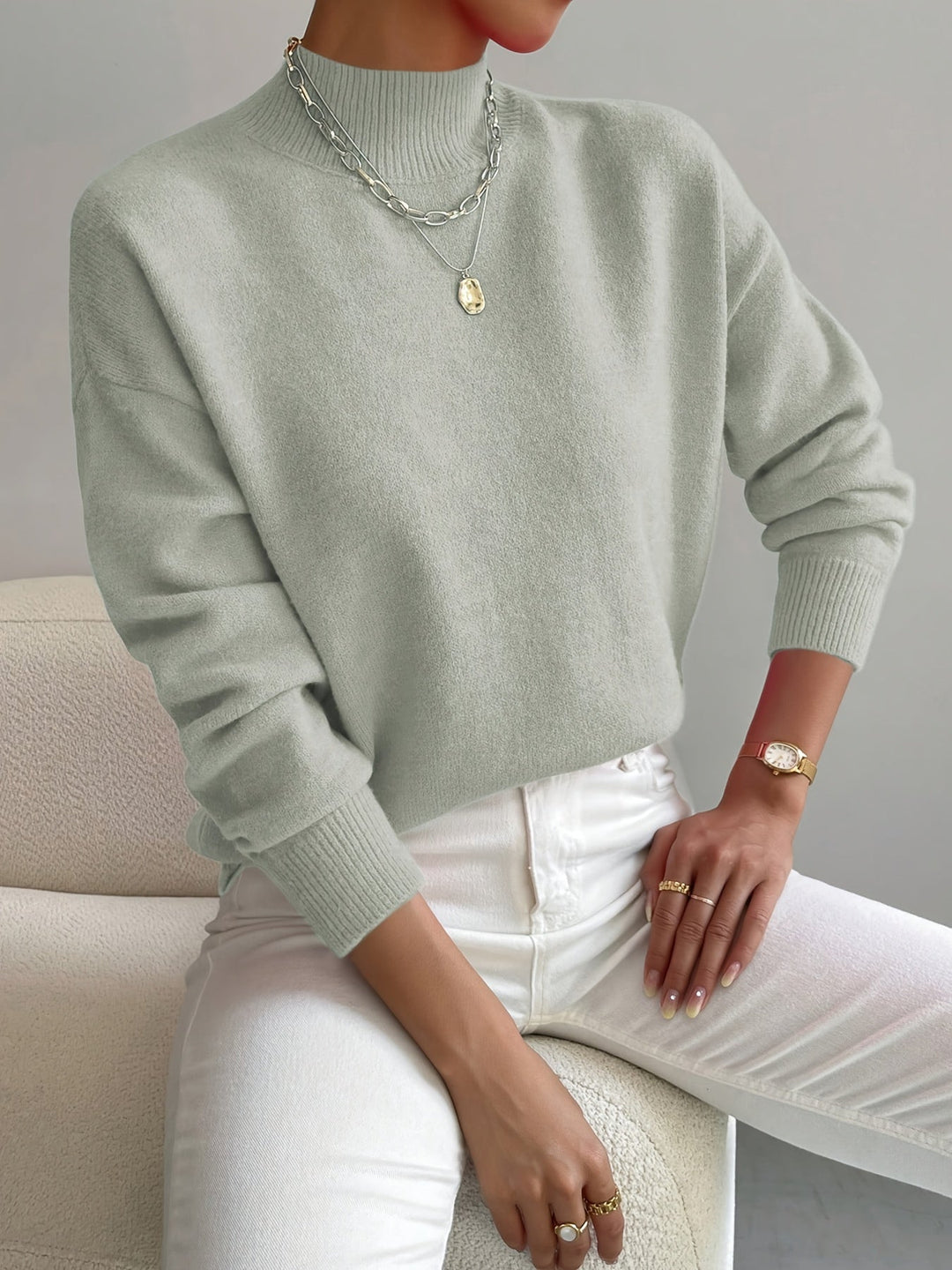 Elegant women's white turtleneck knitted sweater, cozy winter fashion for chic casual wear