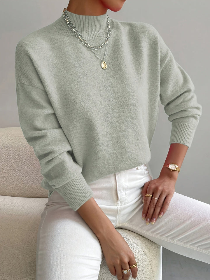 Elegant women's white turtleneck knitted sweater, cozy winter fashion for chic casual wear