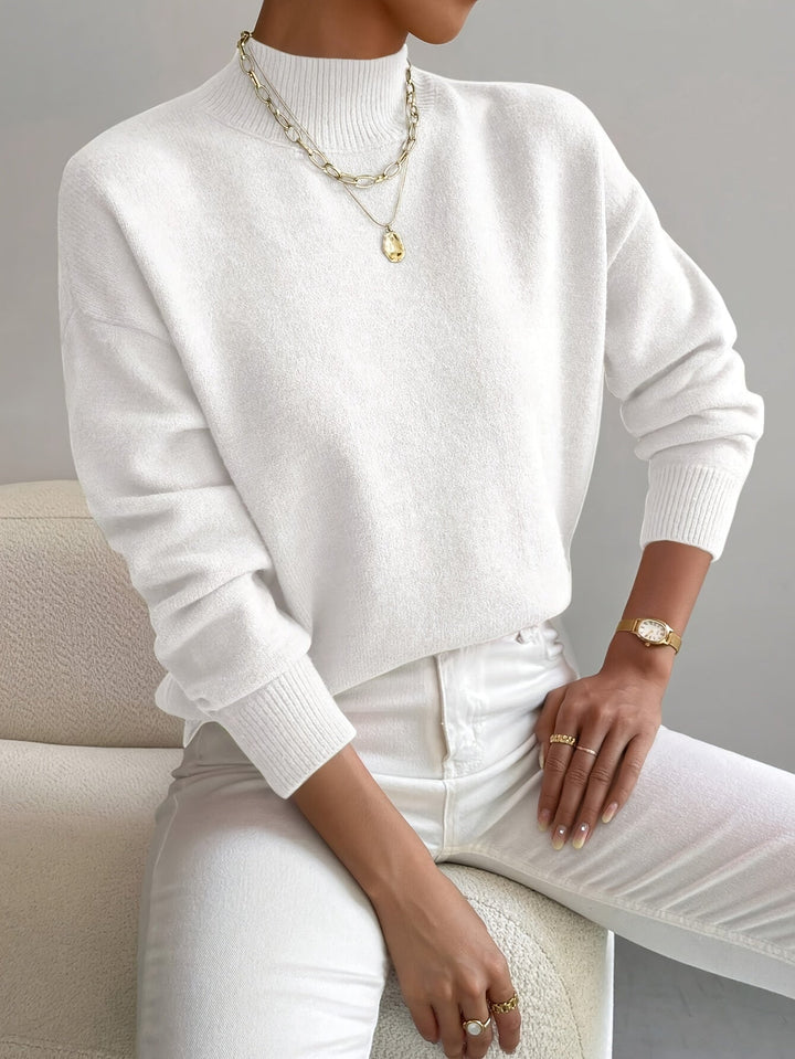 Close-up of a dark grey women's knitted turtleneck sweater, perfect for elegant winter casual style