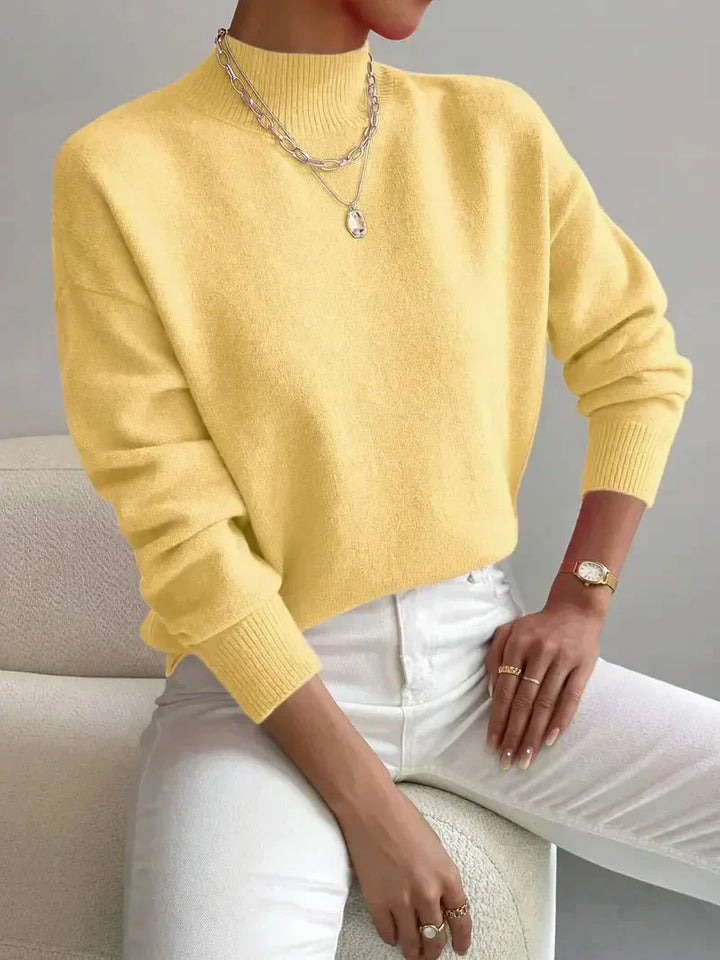Stylish black knitted turtleneck sweater for women, elegant and versatile for winterfashion outfits