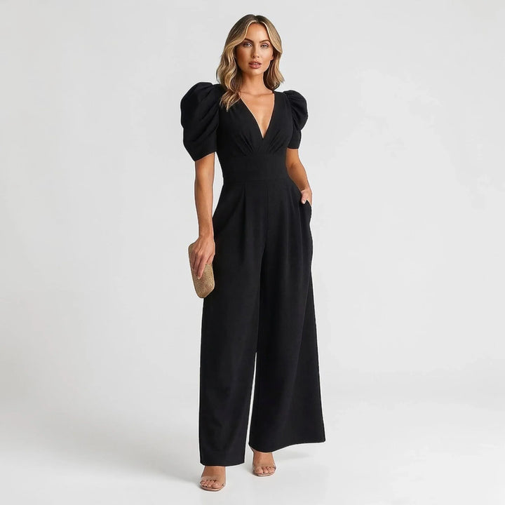 Black elegant women's wide leg jumpsuit with puff sleeves, ideal for evening parties.