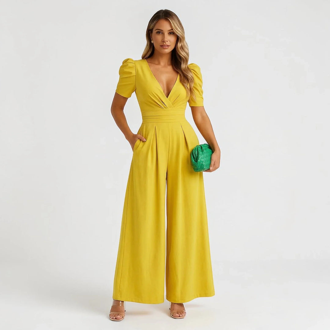 Green tailored wide leg jumpsuit with puff sleeves, an elegant choice for any occasion.
