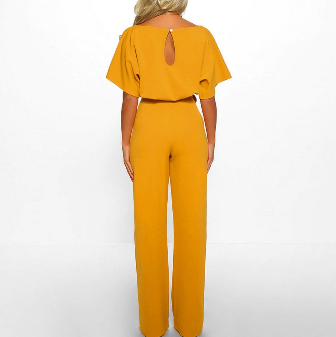 Formal women's wide leg jumpsuit. Features elegant flutter sleeves, perfect for business or special occasion wear.