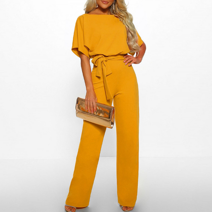 Flattering wide leg jumpsuit for women with delicate flutter sleeves, an elegant choice for party outfits.