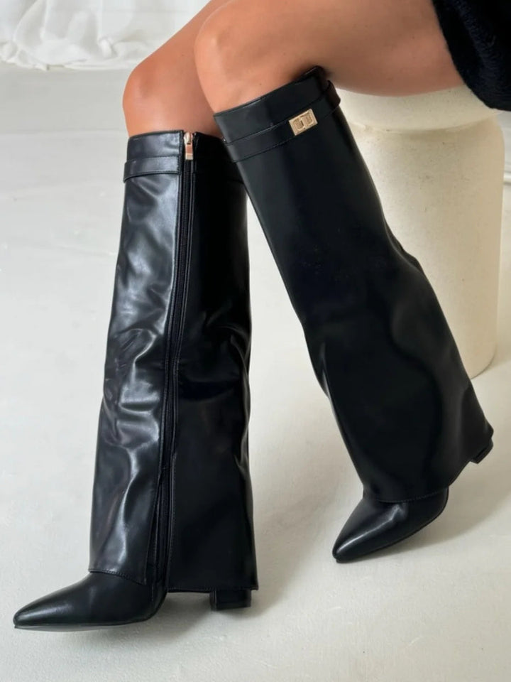 Stylish women's wide leg leather heeled boots, perfect for winter outfits, with a distinctive folded top.