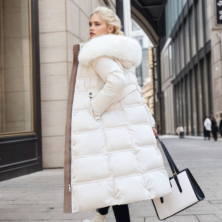 Elegant women's winter jacket with removable hood, polyester blend, providing warmth and style.