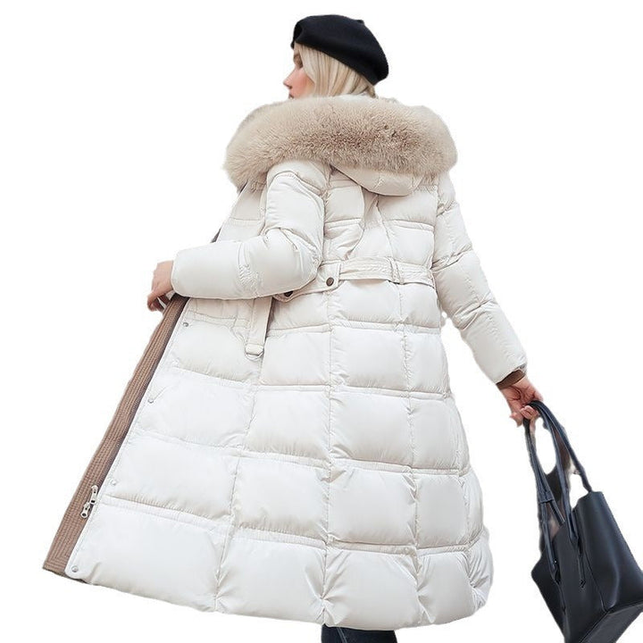 Women's outerwear: chic polyester blend winter coat with a versatile removable hood.