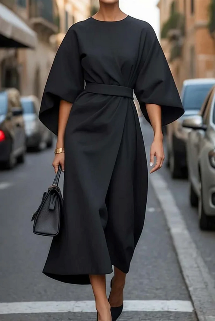 Elegant women's winter midi dress with stylish lantern sleeves, perfect for cold weather fashion.