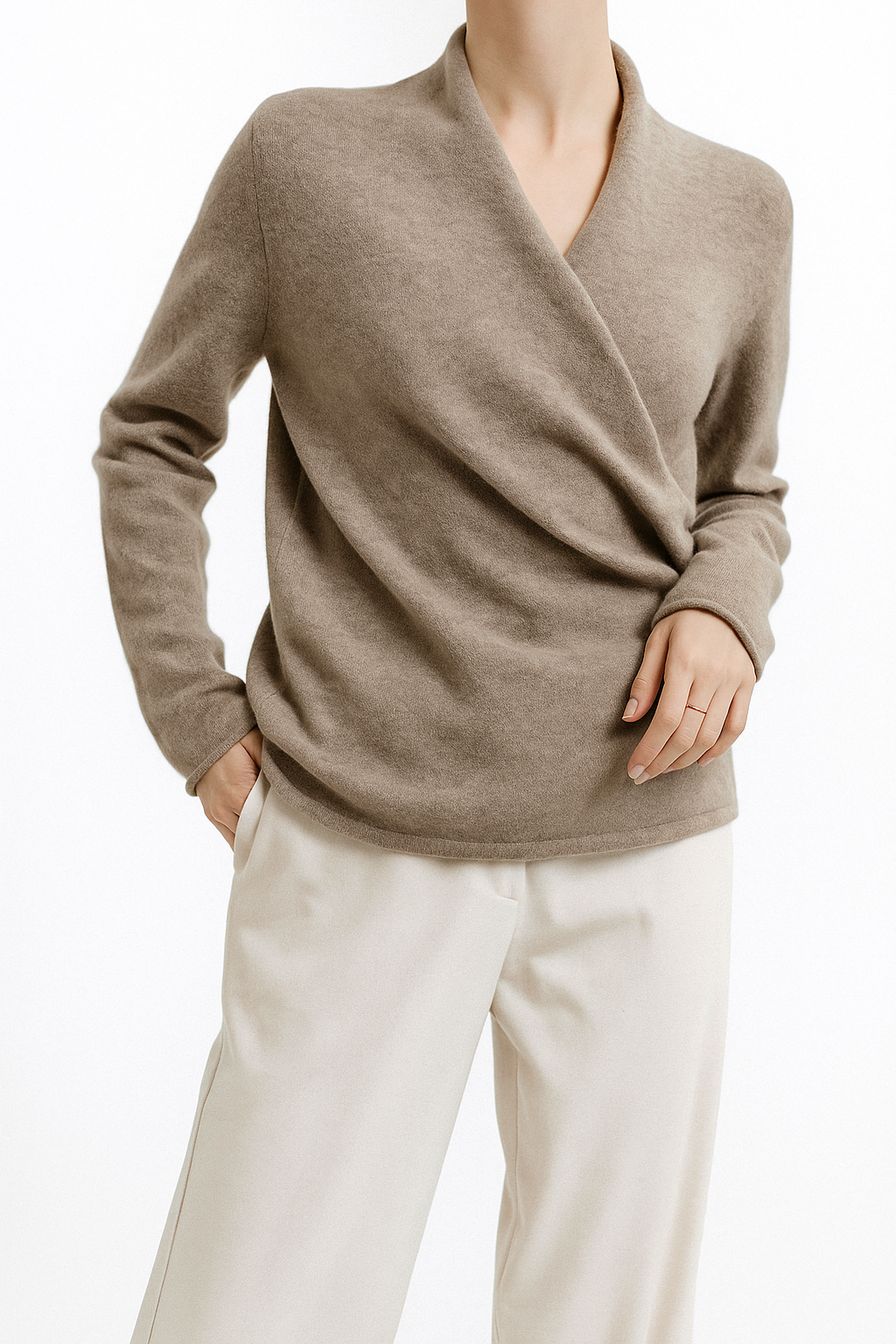 Side profile of a woman wearing a cozy V-neck wrap knit sweater, perfect for winter.