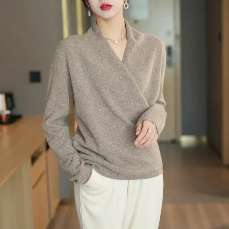 Close-up of the plush knit material on a women's winter wrap V-neck sweater.