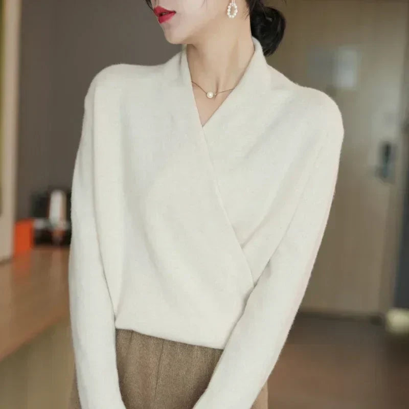 Elegant women's wrap neck knit top in cream, perfect for spring fashion. Long sleeve & comfortable.