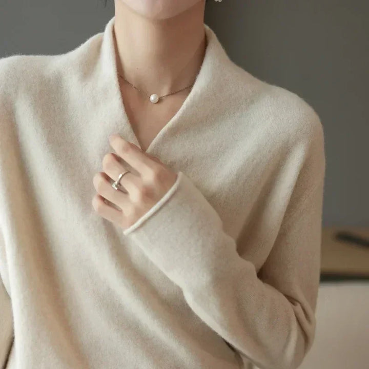 Front view of a women's wrap neck knit top, displaying its flattering silhouette. Great for spring/summer.