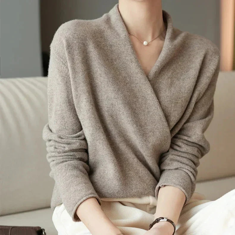 Soft grey women's wrap neck knit top, an essential long sleeve for casual or dressed-up occasions.
