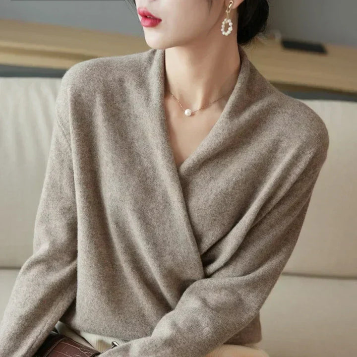 Women's long sleeve wrap neck knit top in a vibrant color, offering a comfortable and stylish look.