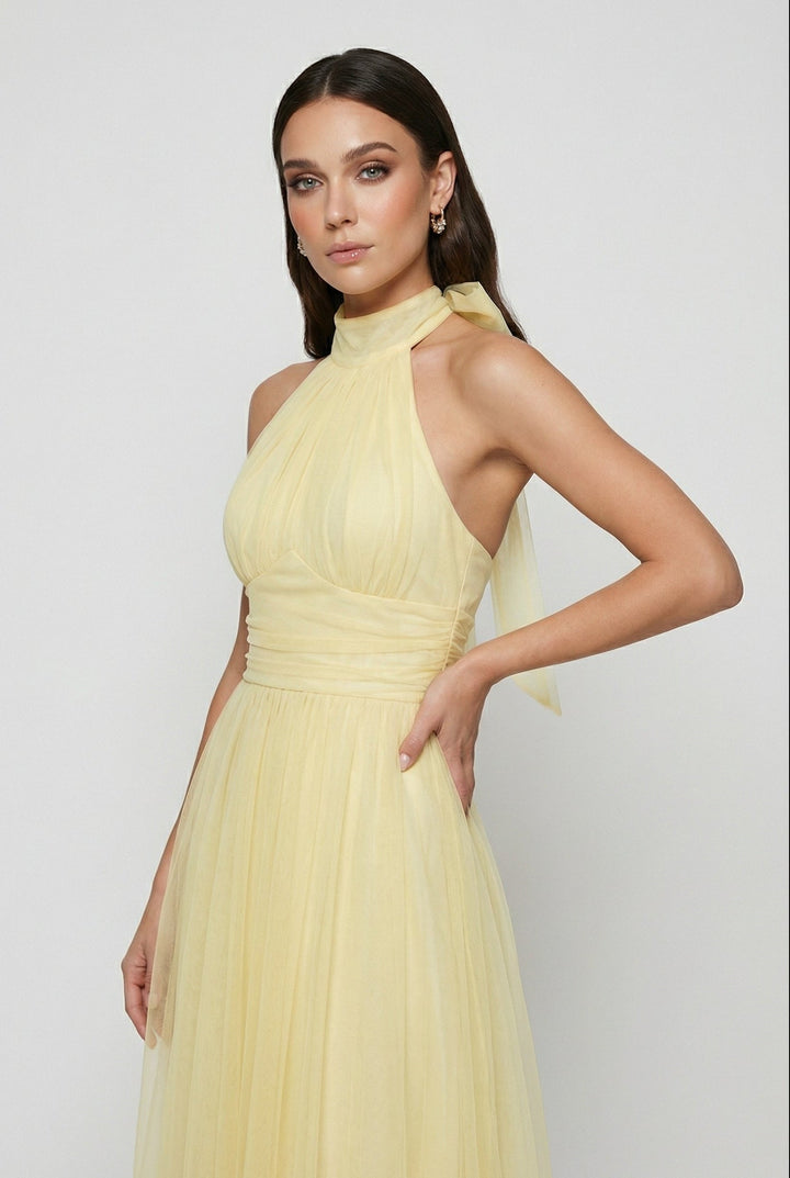 Vibrant yellow midi dress featuring a stylish halter neckline and back tie, great for women's party wear.