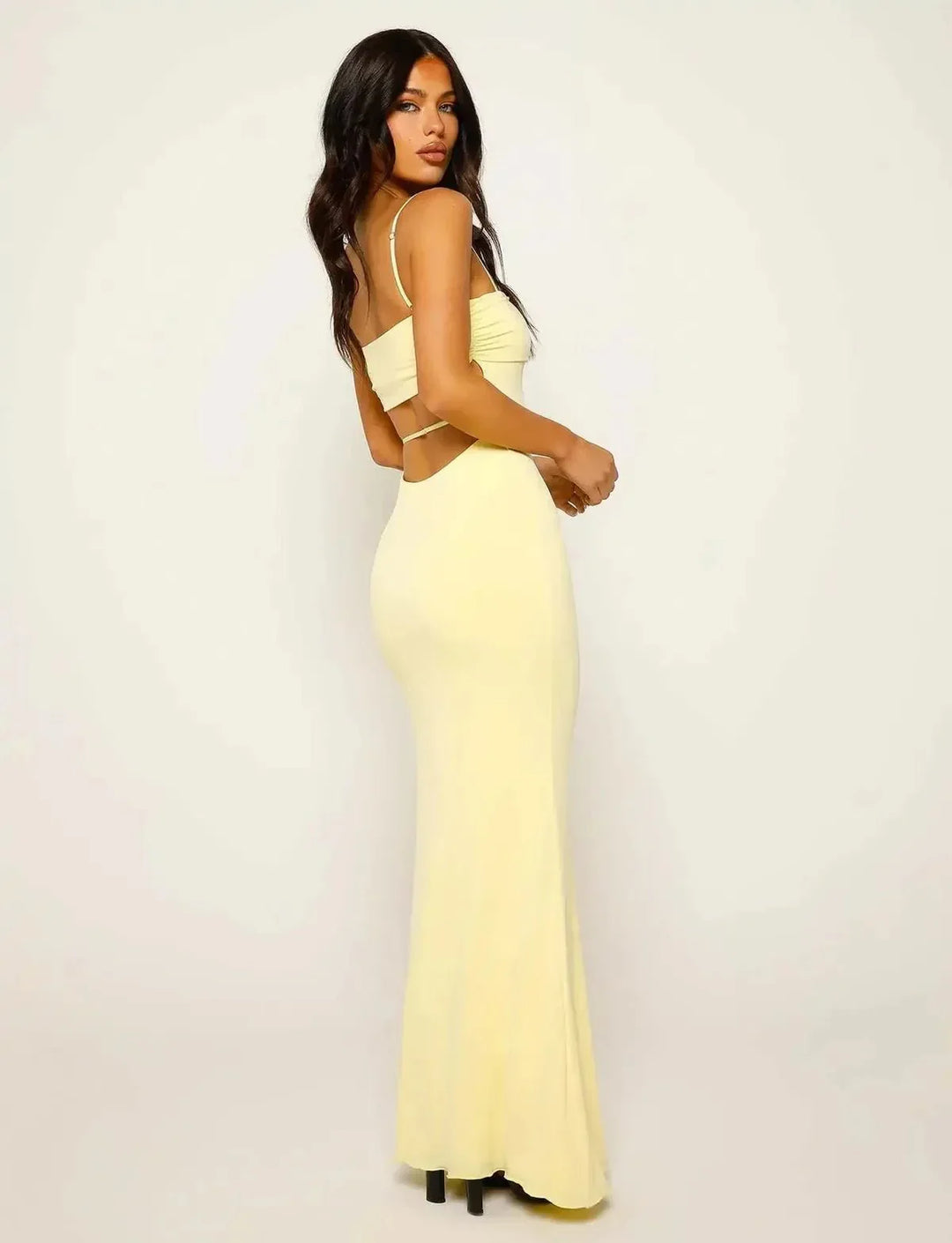 Women's sleeveless yellow maxi dress, elegant backless bodycon style for evening wear & special occasions.
