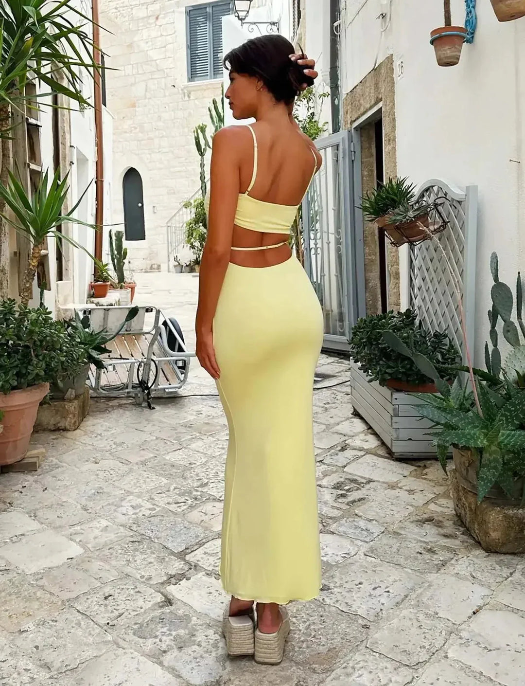 Yellow bodycon maxi dress for women. Elegant backless design, ideal for evening parties & formal events.