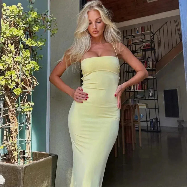 Women's elegant yellow backless bodycon maxi dress, perfect as an evening or party dress.