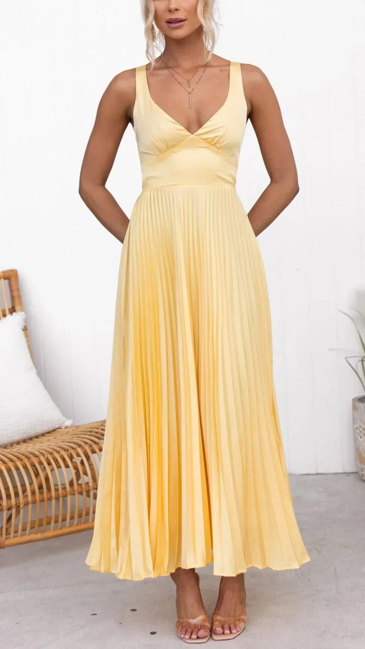Women's fashion: vibrant yellow pleated V-neck maxi dress with flowing silhouette