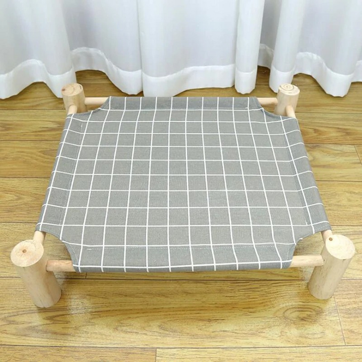 Comfortable linen fabric elevated cat bed promoting pet health. Stylish & washable pet furniture for indoor/outdoor cats.
