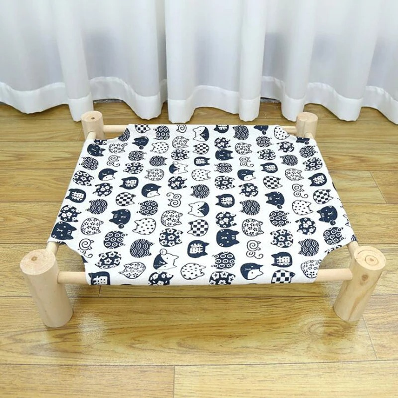 Modern elevated cat bed with breathable linen fabric for superior pet comfort. Durable & washable pet furniture.