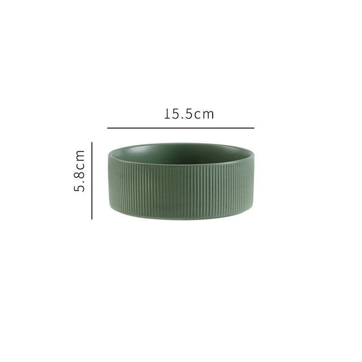 Elegant elevated pet feeding bowls: ceramic and wooden stand for stylish pet dining.