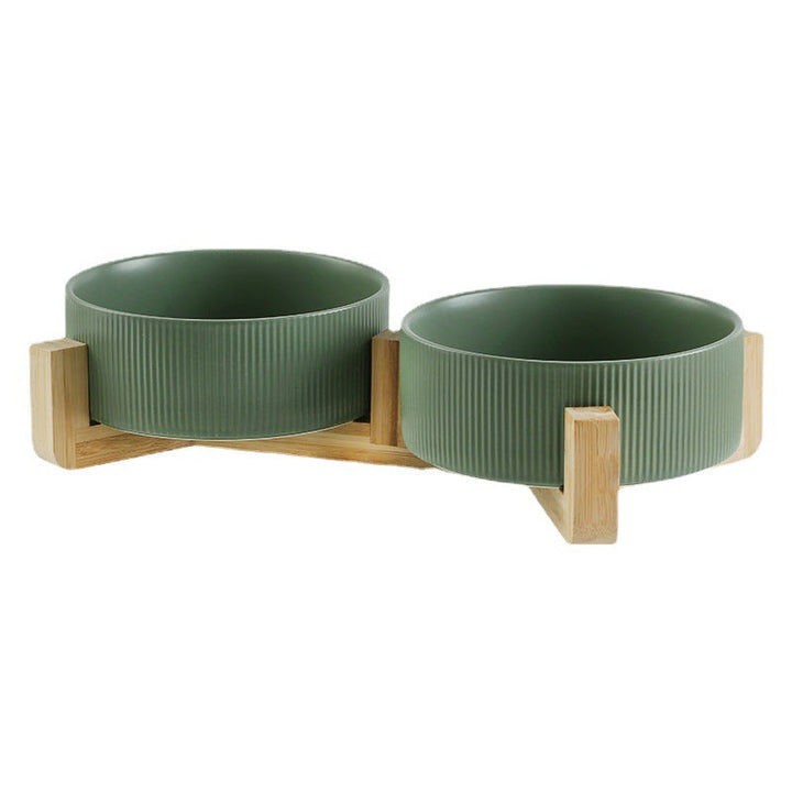 Pet feeding station: elevated ceramic bowls in a sleek wooden stand for dogs & cats.