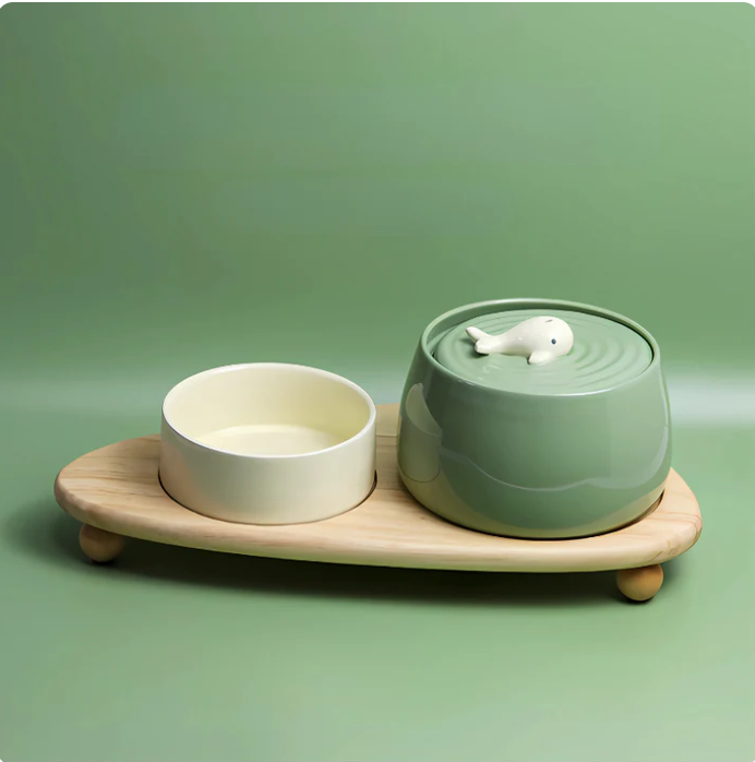 Modern elevated ceramic dog bowls on a sleek wooden stand, promoting better posture for pet dining.