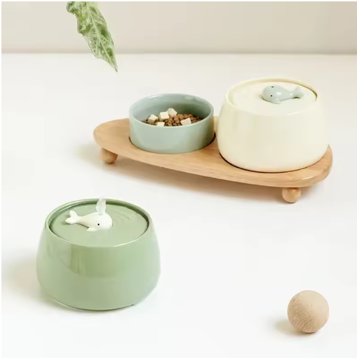 Healthy feeding solution: Elevated ceramic cat bowls on a natural wooden stand, reducing neck strain.