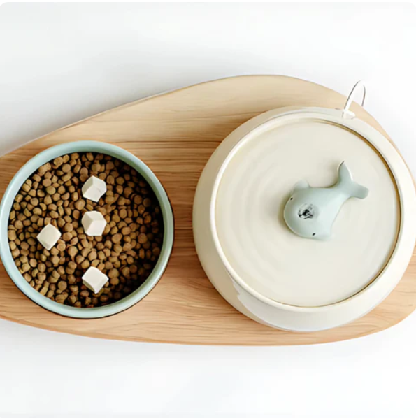 Wooden stand supporting elevated ceramic pet bowls, designed for comfortable and clean dog & cat feeding.