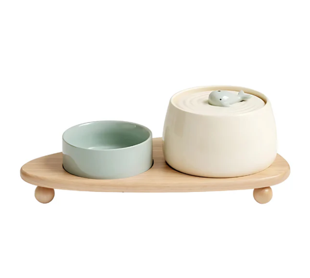 Premium elevated pet feeder: Ceramic bowls on a robust wooden stand, ensuring healthy eating for dogs & cats.