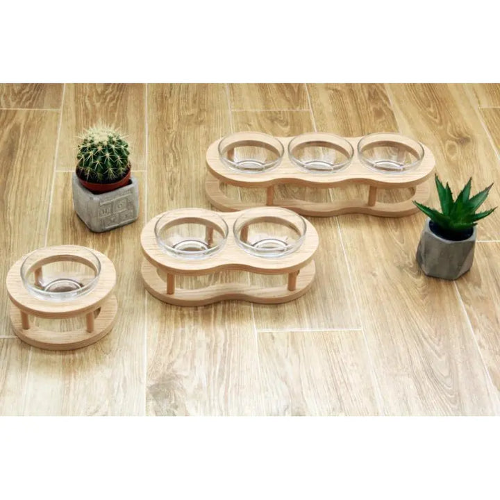 Stylish elevated dog & cat food bowl set on a wooden stand. Improves pet dining posture & digestion.